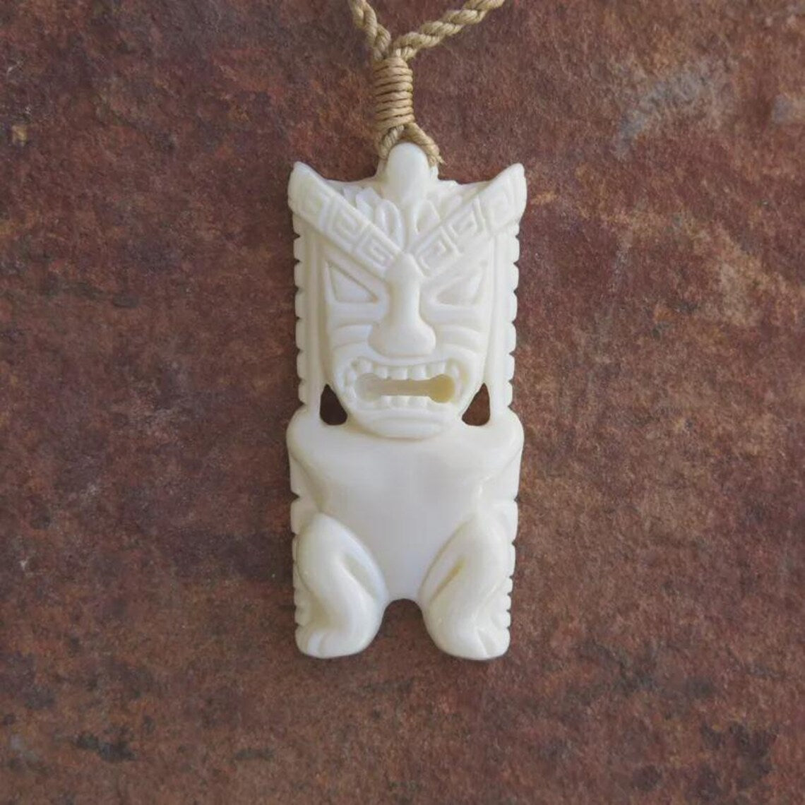 Tiki Carved Pendant